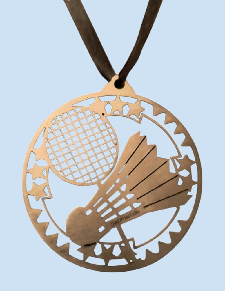 Fotografia przedstawia medal z Turnieju Badmintona.